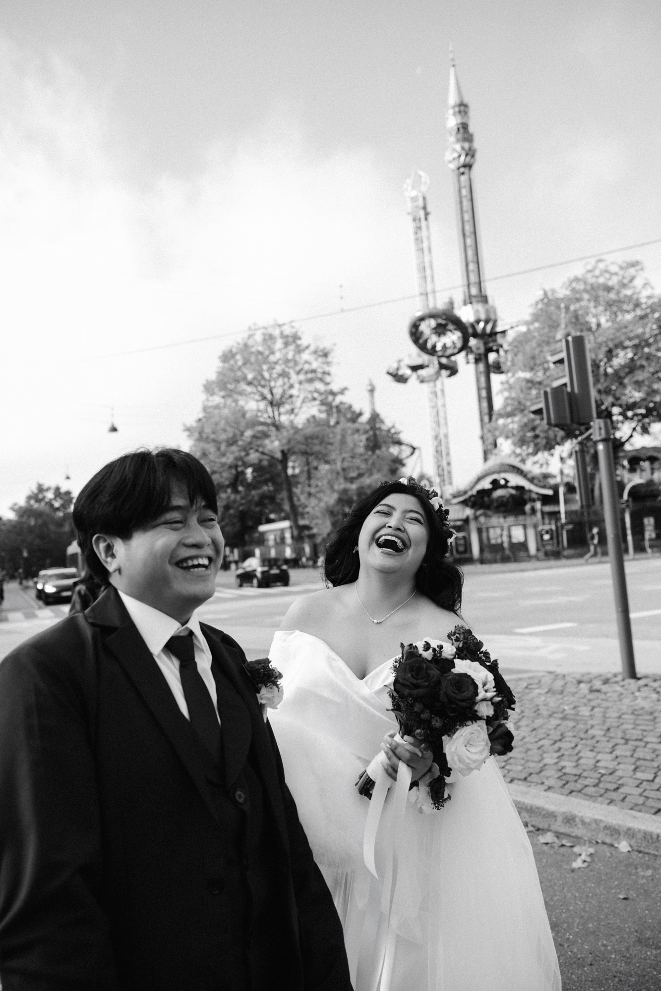 Young wedding couple walking on the street near Tivoli in Copenhagen